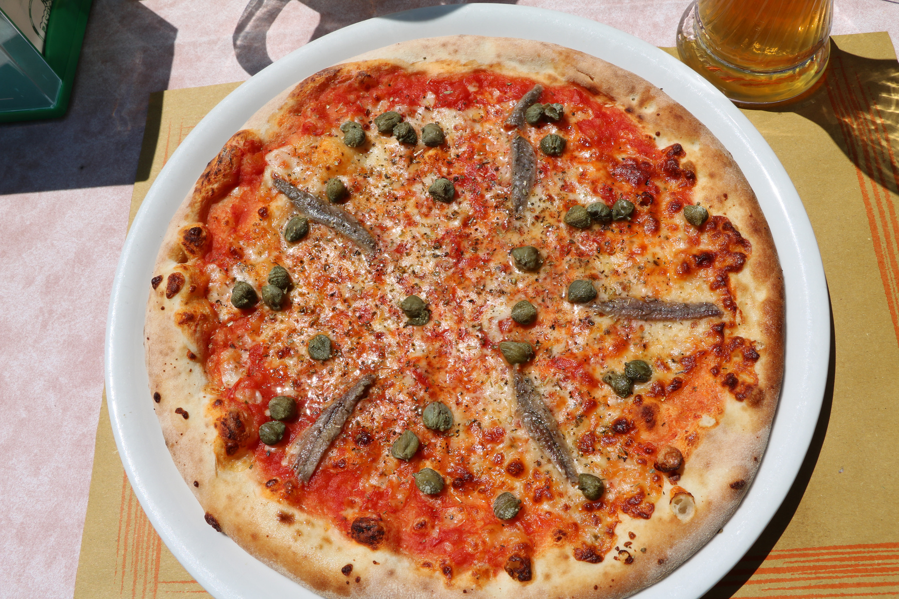 Pizza with capers and anchovies called Pizza Napoli