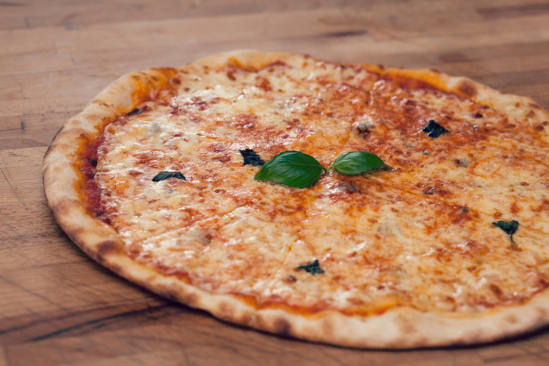 Pizza on Wooden Background